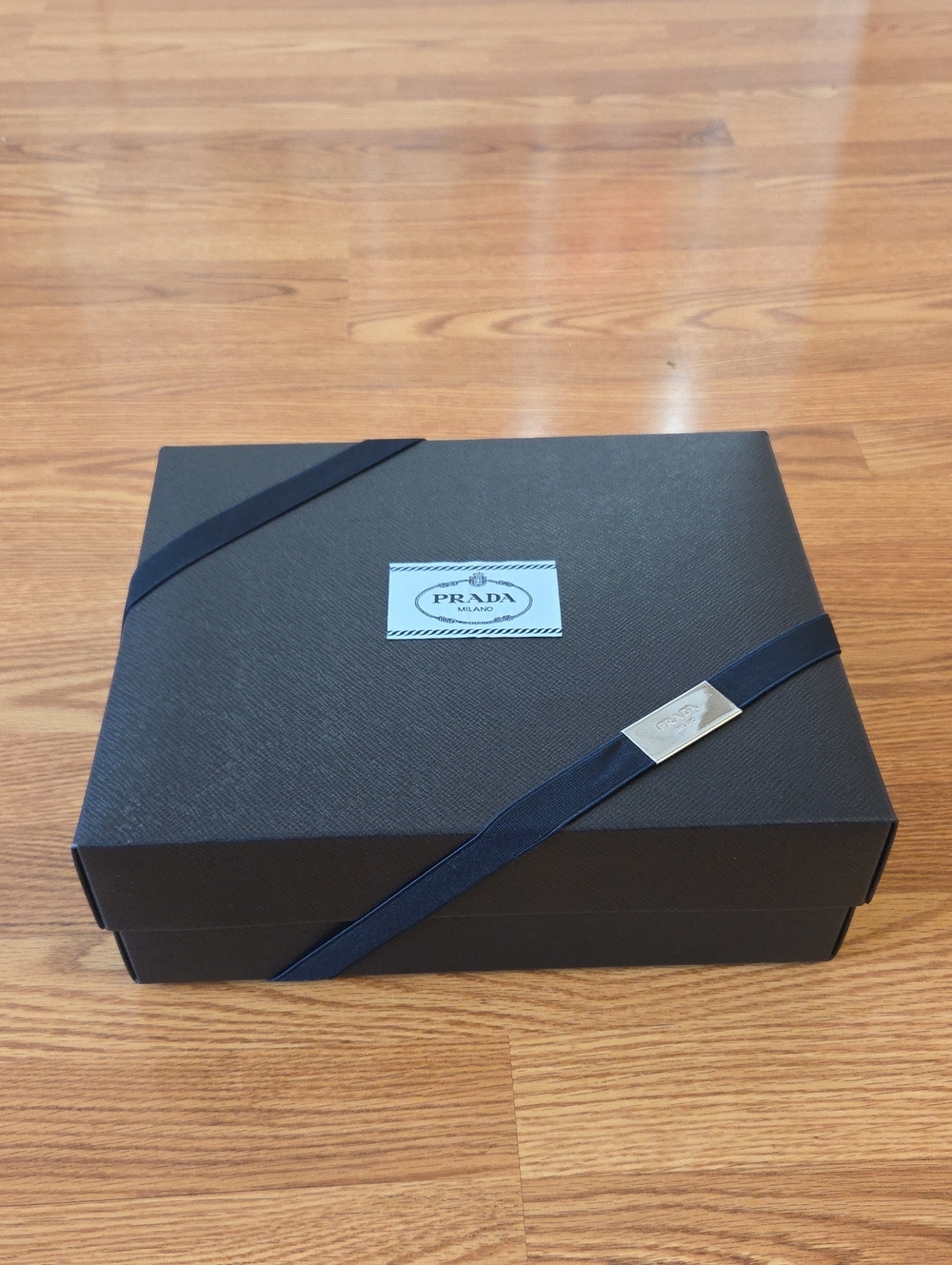 Prada Black Box with Navy Ribbon and Metal Plaque